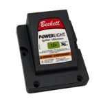 Beckett PowerLight 12V igniter module mounted in a black plastic housing.